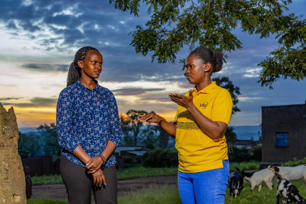 Brown, a VSO deaf volunteer discussing with Joy, a sign language interpreter