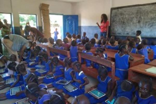 Children using tablets in class