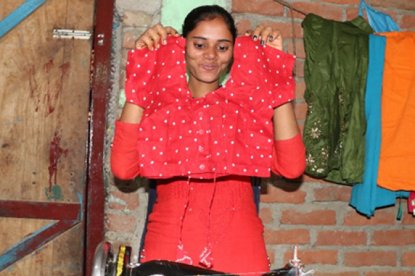 Anju with a dress she's sewn