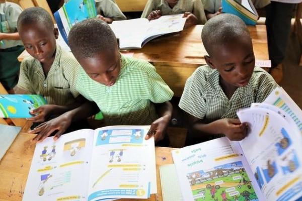 Rwandan primary school children with text books