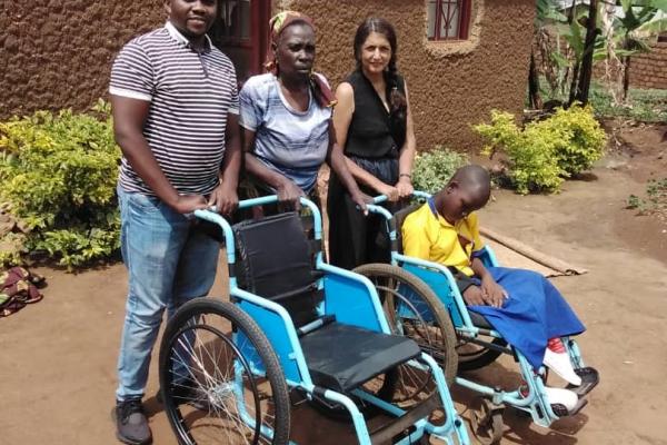 Volunteers bring new wheelchairs to pupils