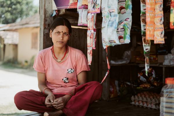 Nepalese woman outside her shop