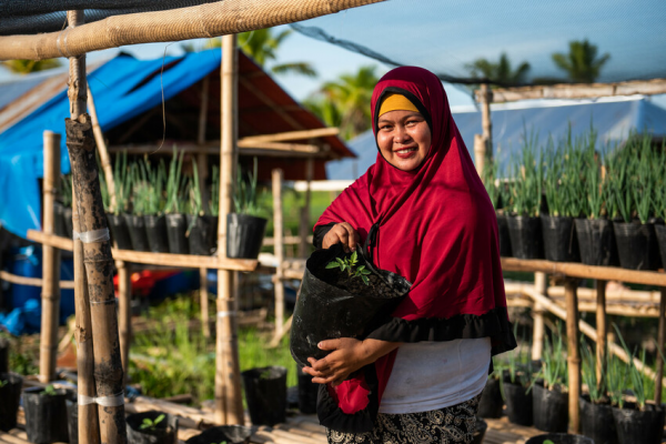 Woman smiling with organic crops