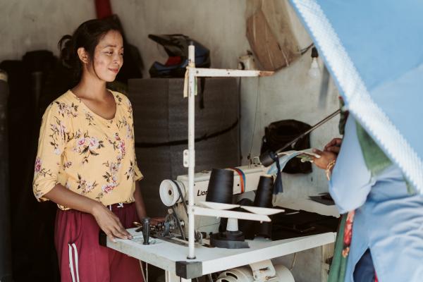 Aasha at her tailoring business