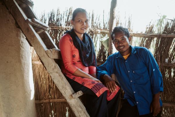 Sima and Suren smiling at the camera.