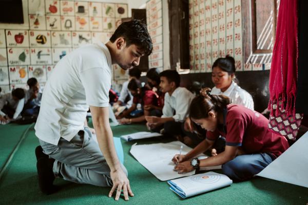Volunteer Raj in a school classroom.