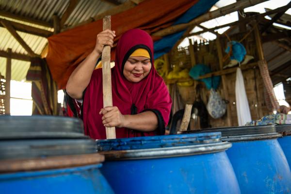 Woman making biofertilizer