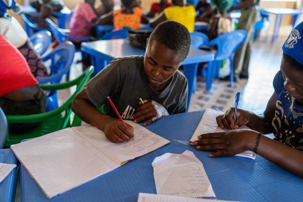 Child writing in class