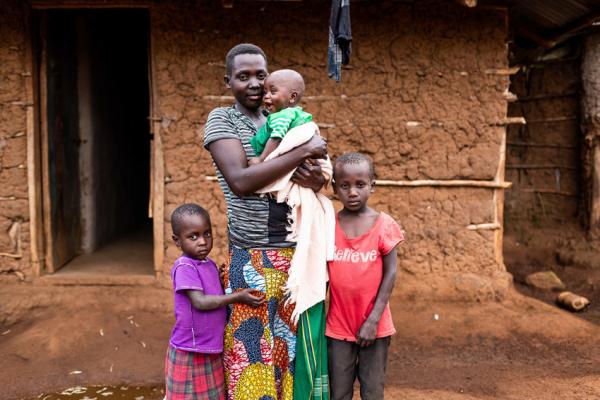 Young woman with two children and a baby.