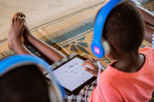 A student learning on an educational tablet.