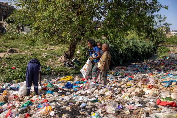 Elizabeth at the dump site with her two children