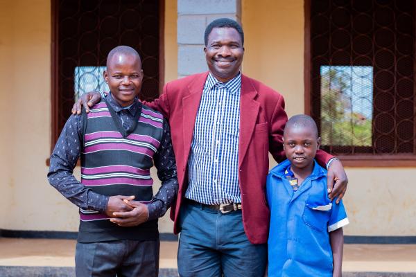 Teacher Peter, VSO volunteer Theo and student Thoko.