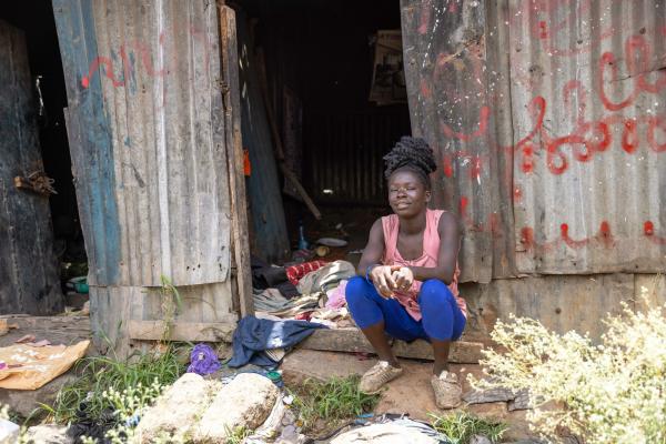 Doreen, waste picker, outside her house