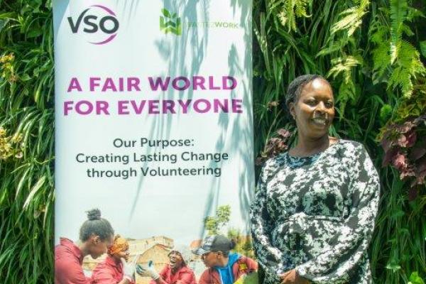 Catherine with a VSO banner