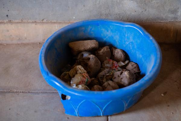 A bucket with clay in it that students use in art class