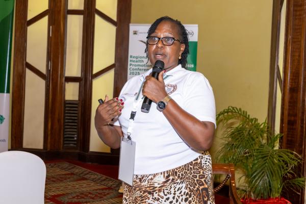 Woman speaking into microphone