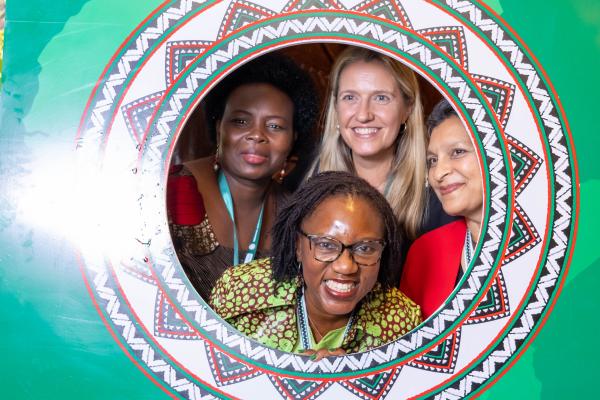 VSO staff and Kenya health leaders in photo stand in