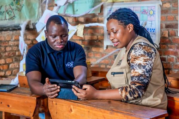 Two people using tablet