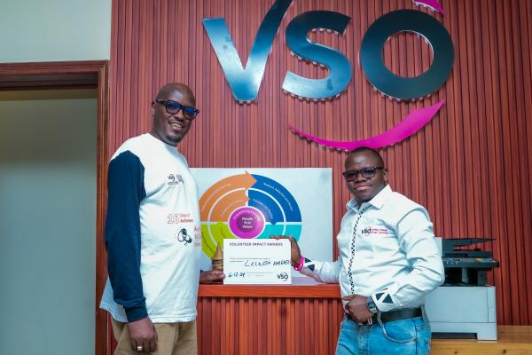 Celestin holds certificate