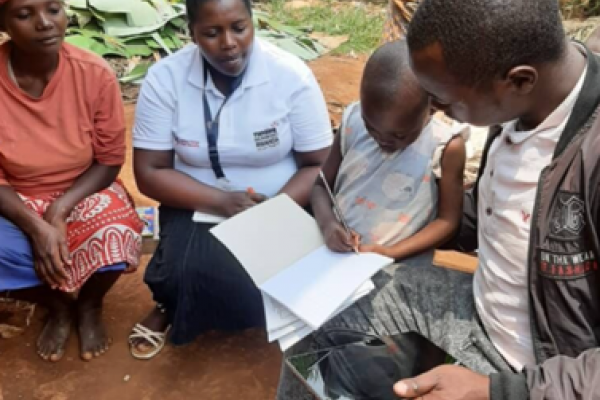 Diane Uwamahirwe, a national volunteer, during a home visit