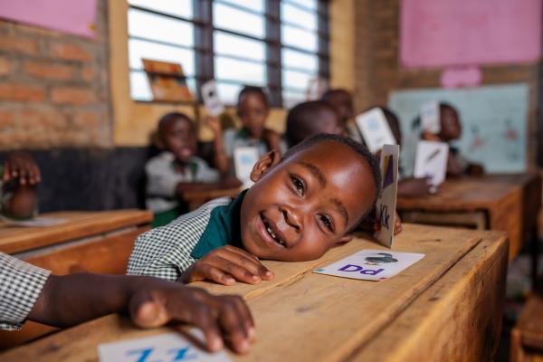 Student Ella sitting at her desk in the classroom