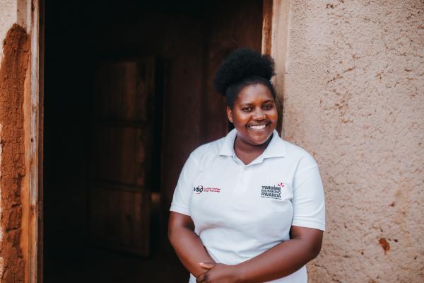 Diane smiling outside a building