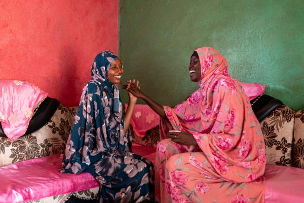 Safia laughing with Aliya.