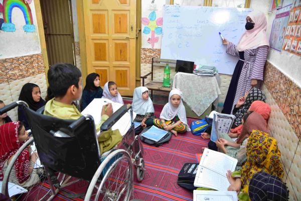 Khadija teaching in her learning centre