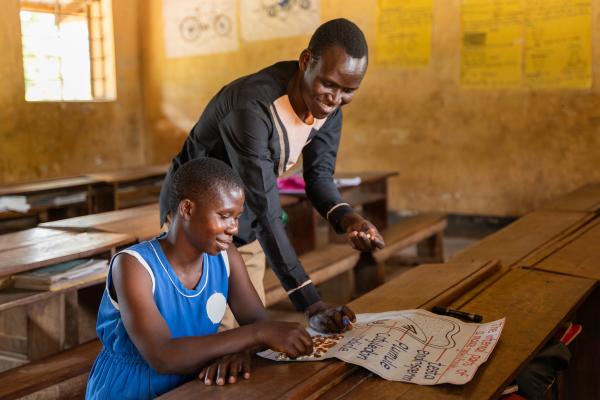 Juliet (right) in class with her teacher Elijah (left)