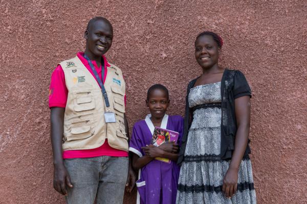 VSO volunteer Alfred, student Nakiru and teacher Yeko.