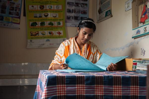 VSO volunteer Anonna reading through notes.
