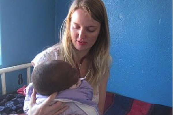Volunteer Eileen Parks treats a child in a hospital in Zambia