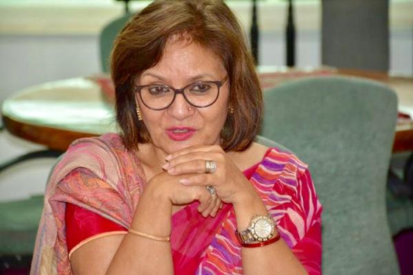 Dr Madhuri Singh as eminent VSo volunteer in Pakistan Dr Madhuri Singh conducting a meeting
