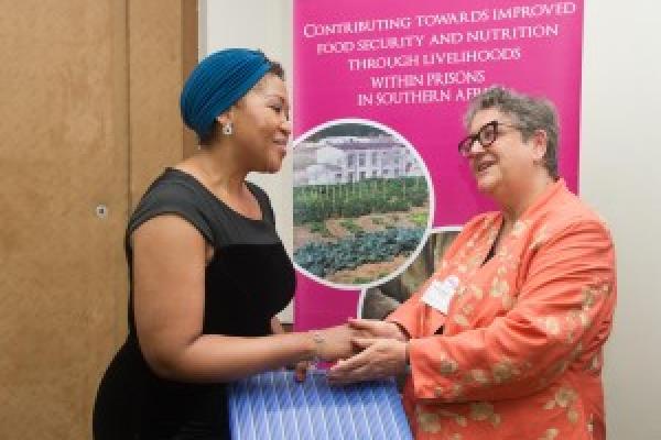 Baroness Barker presents an award from VSO to First Lady Tobeka Madiba Zuma