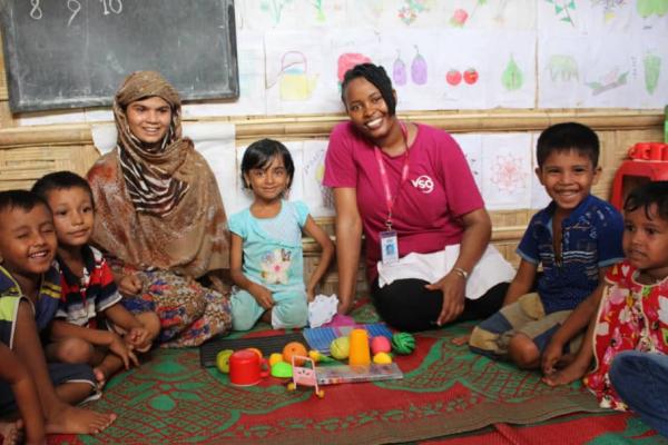 Ann Wambui with Rohingya children at one of the education centres at Cox's Bazar refugee camp.