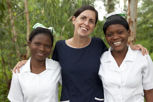 Zione Lipenga, and LilianMkunga (braided hair) Community Midwife Technician students with Beth Connelly a VSO volunteer