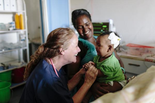 VSO volunteer Patricia Doyle with seven-month-old baby Eldana Akieiu and her mother Abaynesh Girma in the new paediatric High Dependency Unit (HDU) at Nigist Eleni Mohammed Memorial Hospital in Hosanna, Ethiopia
