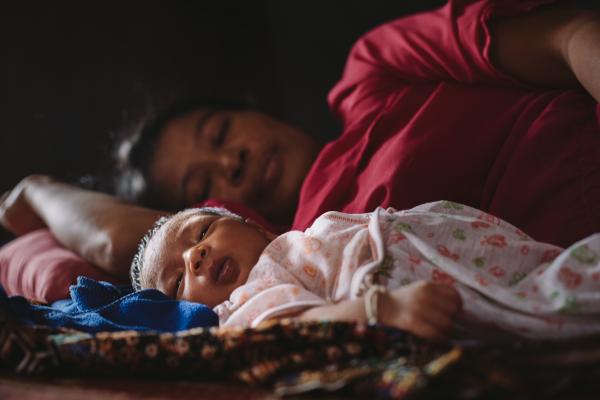 A mother and baby asleep