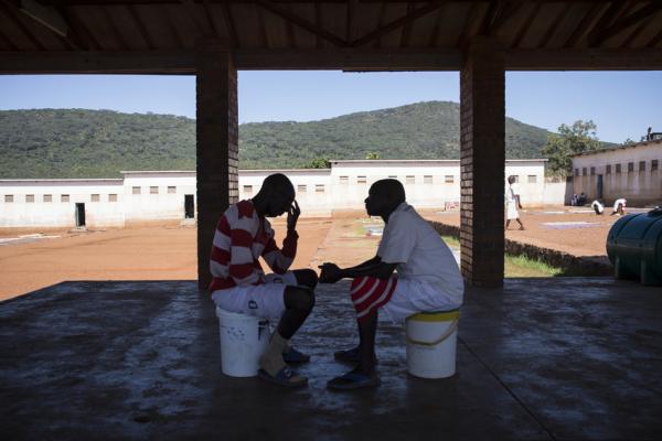 Prisoners during a one-to-one peer education counselling session at Mutimurefu Prison.