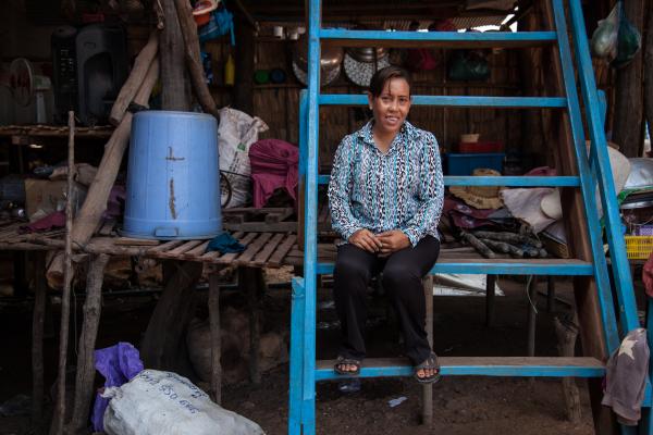 Image of Chaun Lan, 42, sitting down in fishing hut.