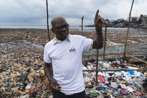 Saidu Turay, stood in Kroo Bay, a slum in Freetown, Sierra Leone.