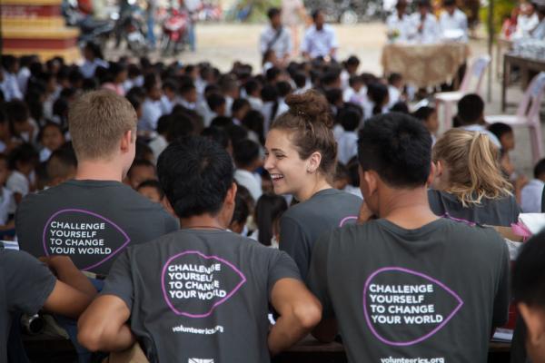 ICS volunteers on placement in Cambodia ICS volunteers sit in front of a big group of children in Cambodia