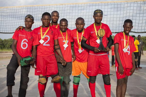 A team of goalball players in Ghana stand proudly with their trophy