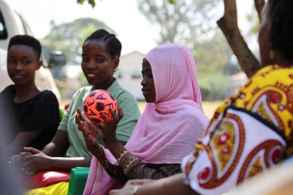 Jida, pictured here in the pink headscarf, has been thinking about some of her dreams in life, and will be supported by VSO to reach her career goals. 