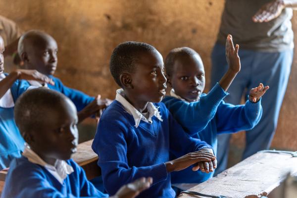 Students Learning Kenya sign language from VSO volunteers