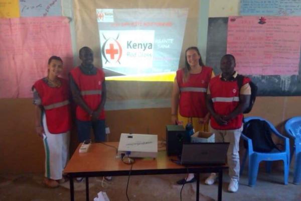 Ria's team supported the Kenyan Red Cross with organising local blood drives Ria Bhate with Red Cross volunteers